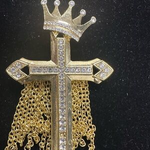 Sassy Jones gold and silver cross brooch.